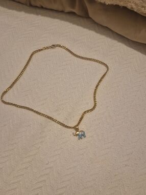 Gold Elephant Pendant Necklace with Light Blue Enamel